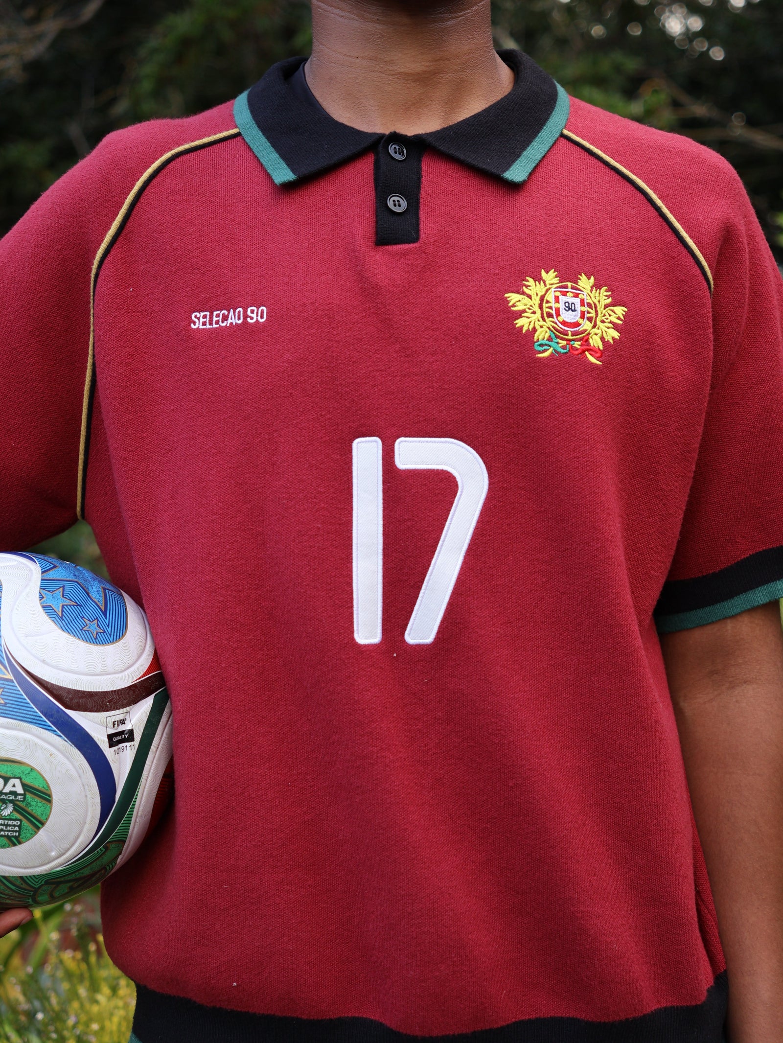 Close up of the embroidered crest and appliqué number 17 on the Section 90 Portugal knitted jersey