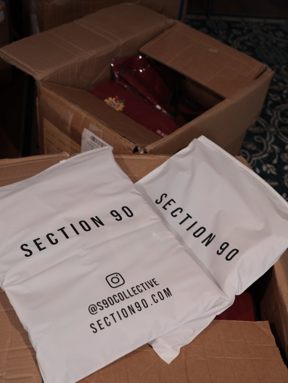 Section 90 packaging, knitted jerseys folded in branded mailers ready to ship